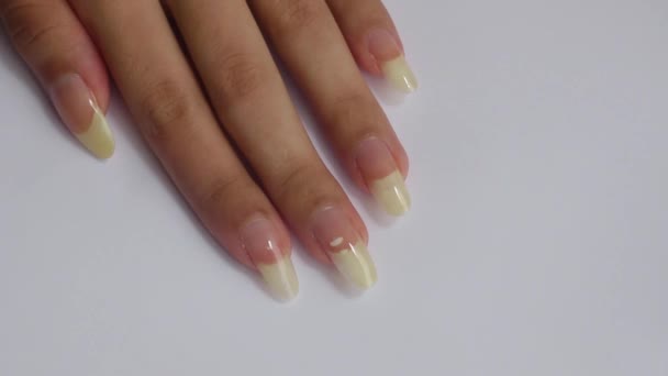 Female Hand Long Natural Nails Topcoat White Background Muehrcke Lines — Stockvideo