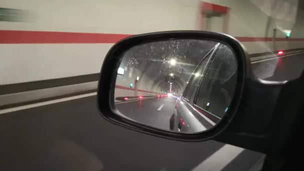 Passing Highway Tunnel Looking Rearview Mirror Close View — Vídeo de Stock