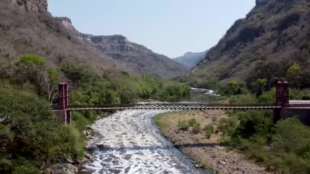 Aerial Drone Flying Suspension Bridge Person Walking Wild Canyon — Stok video