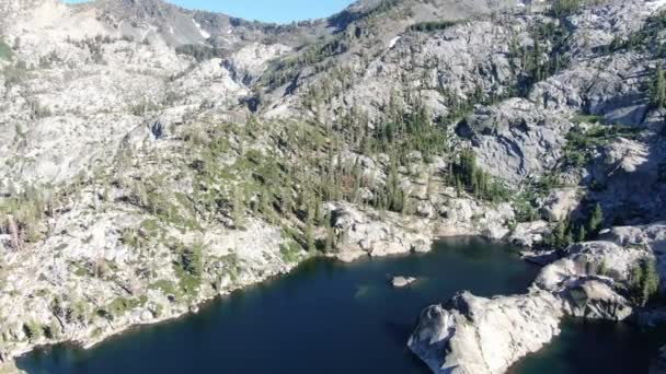 Slow Stabilized Drone Aerial Shot Reveals Alpine Lake Base Mountain — Vídeos de Stock