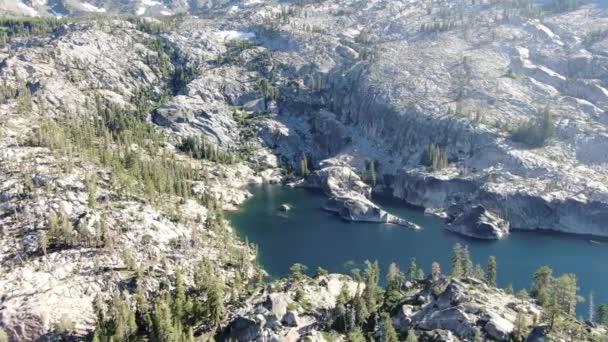 Sunny Stabilized Drone Aerial Shot Shows Alpine Lake Base Mountain — Video Stock