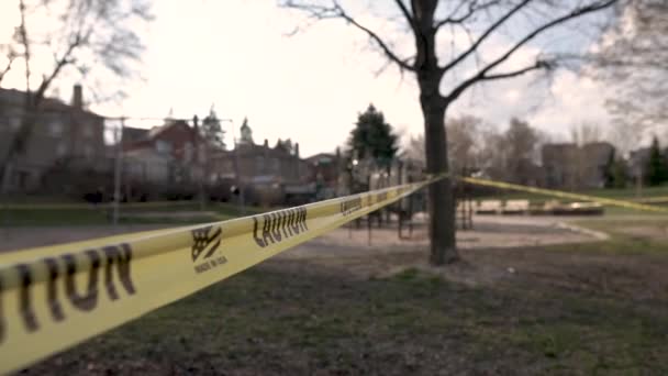 Yellow Caution Tape Surrounds Local Playground Closed Due Covid — ストック動画