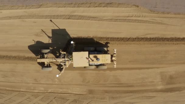 Top Aerial View Road Grader Pushing Leveling Dirt Construction Site — Vídeos de Stock