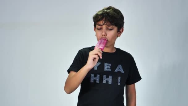 School Boy Eating Popsicle Ice Cream Isolated Grey Background — Vídeos de Stock