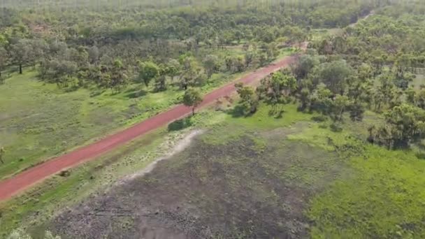 Slow Moving Drone Shot Red Road Green Bushland Holmes Jungle — Stockvideo