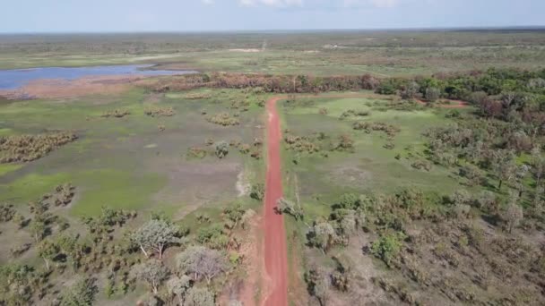 High Aerial Slow Moving Drone Shot Long Straight Red Road — ストック動画