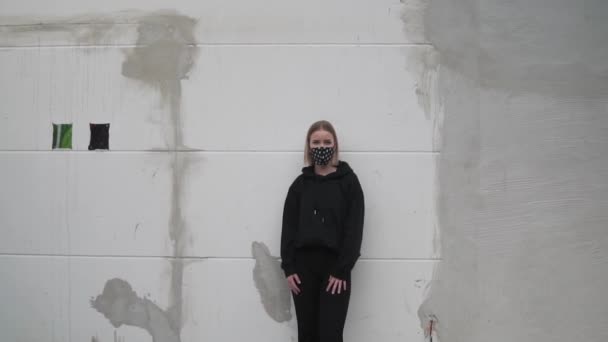 Blonde Girl Black Outfit Face Mask Standing Wall Coronavirus New — Vídeos de Stock