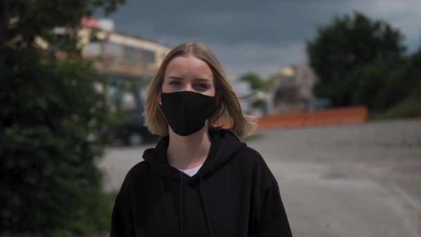 Portrait Young Woman Black Face Mask Looking Camera Urban Exterior — Stok Video