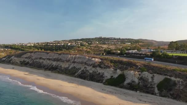 Drone Glides Sunny Coastline Revealing Beautifully Luxury Homes Overlooking Ocean — Wideo stockowe