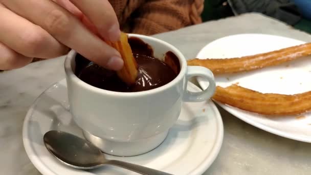 Female Hand Dipping Traditional Churro Mug Thick Dark Hot Chocolate — Stock Video