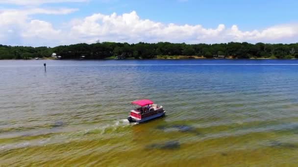 Aerial View Panning Right Pontoon Boat Leaving Some Small Islands — Stock Video