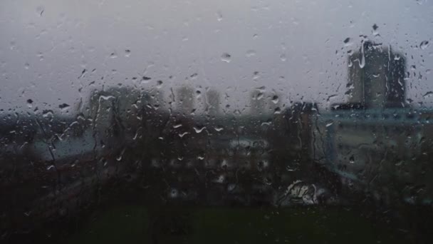 Handheld Shot Rain Dripping Window Urban Area — Stock video