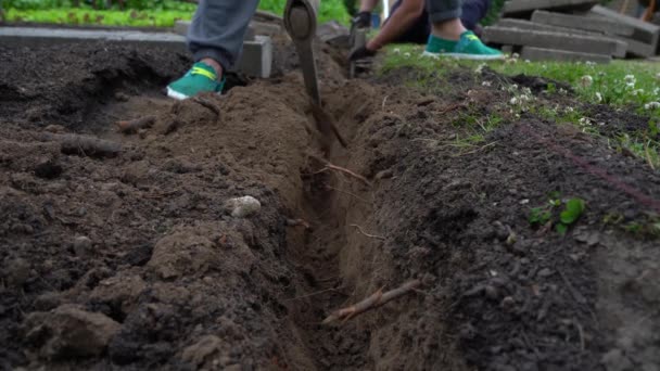 Close Gardener Digging Trench Hand Pickaxe Low Angle Shot — Stockvideo