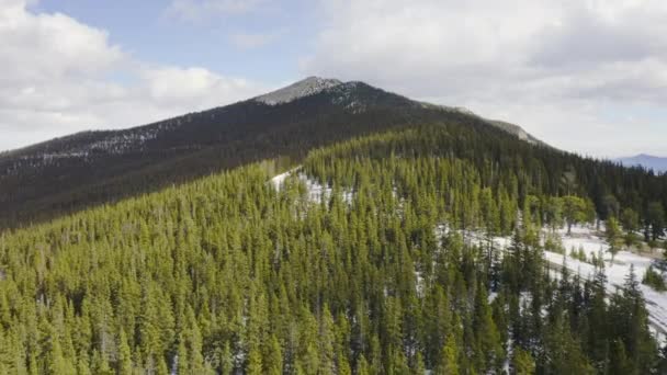 Low Aerial Reveal Forward Sunny Snow Covered Back Roads Colorado — Video