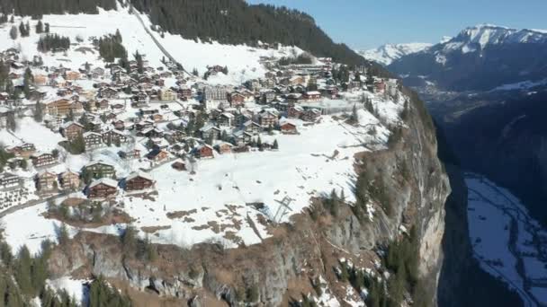 Flying Snow Covered Town Edge Mountain — Stock video