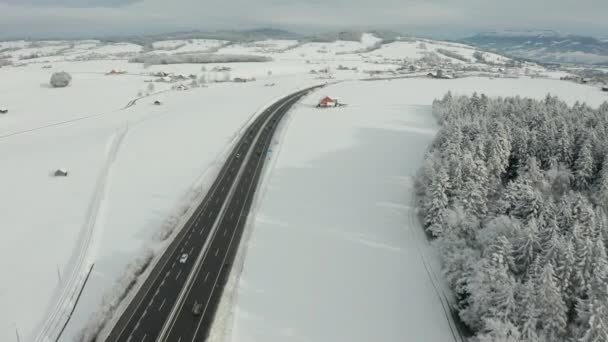 Aerial Highway Running Beautiful Snow Covered Landscape — Stock video