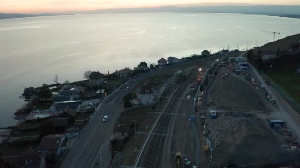 Aerial Small Town Construction Large Lake Sunset — Stockvideo