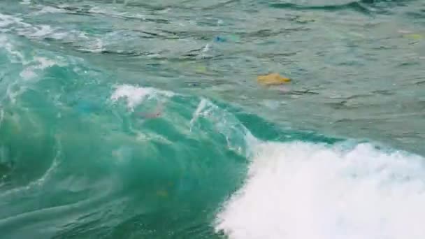 Close Sea Wave Carry Plastic Rubbish Polluting Environment — Stock video