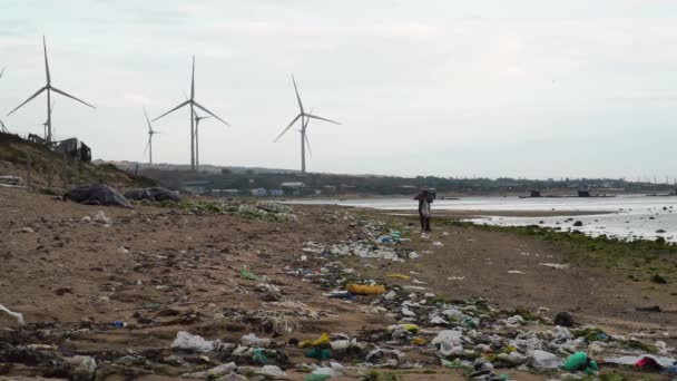 Person Walking Polluted Beach Windfarm Seen Background Son Hai Vietnam — 비디오
