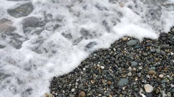 Close Waves Gently Crashing Rocky Shore — Stock video