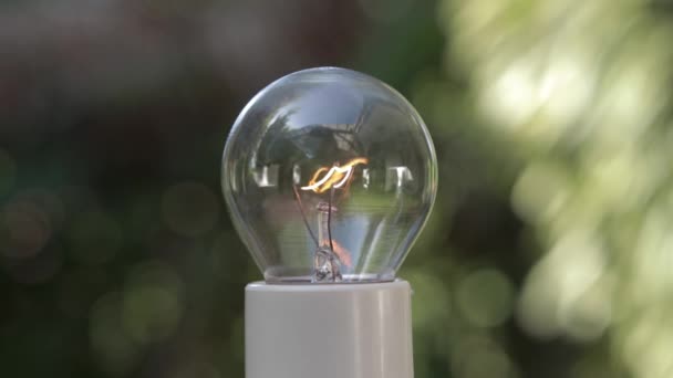 Vintage Light Bulb White Bulb Holder Glowing Blurred Background — Stockvideo