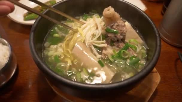 Close Stirring Steaming Pork Rib Noodle Soup — Stockvideo