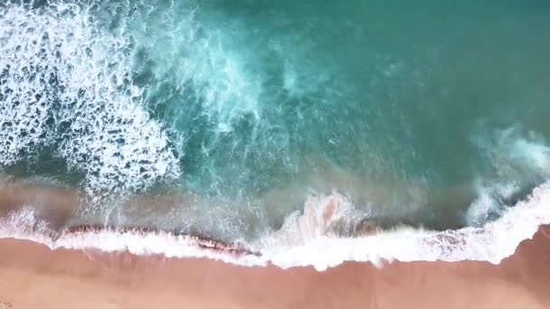 Aerial Top View Ocean Waves Reaching Beach Shore Drone Footage — Wideo stockowe
