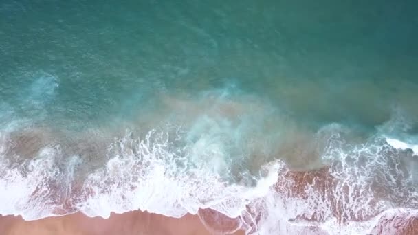 Aerial Top View Ocean Waves Reaching Beach Shore Drone Footage — Wideo stockowe