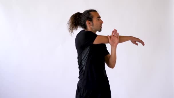 Long Haired Hispanic Man Goatee Stretches Shoulders Arms Front White — Stok Video