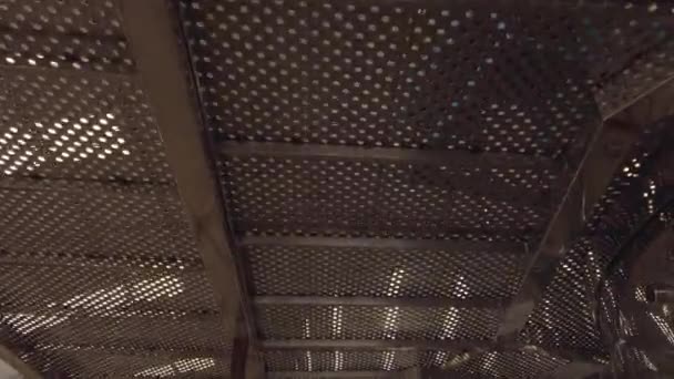 Metallic Aerial Catwalk Filmed Bellow Perforated Steel Sheet — Vídeos de Stock