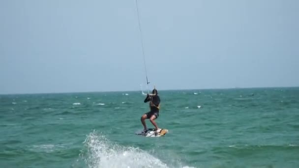 Young Man Doing Kiteboard Maneuvers Tracking Shot — Stock Video