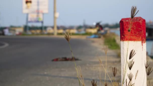 Focus Pylon Marking Road Background Passing Motorcyclist Ground Level Vietnam — Vídeos de Stock