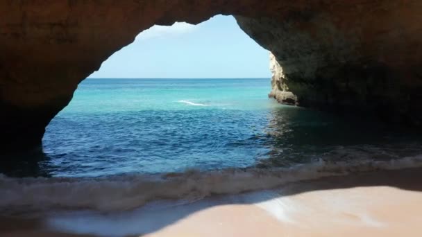 Flying Slowly Sand Beach Exiting Cave Beautiful Blue Ocean — Stockvideo