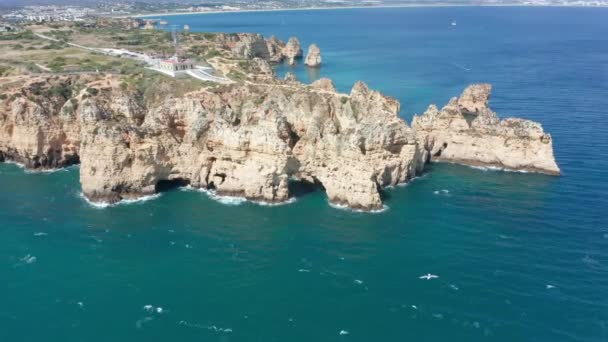 Aerial Beautiful Eroded Cliff Formation Shores Blue Sea — Stockvideo