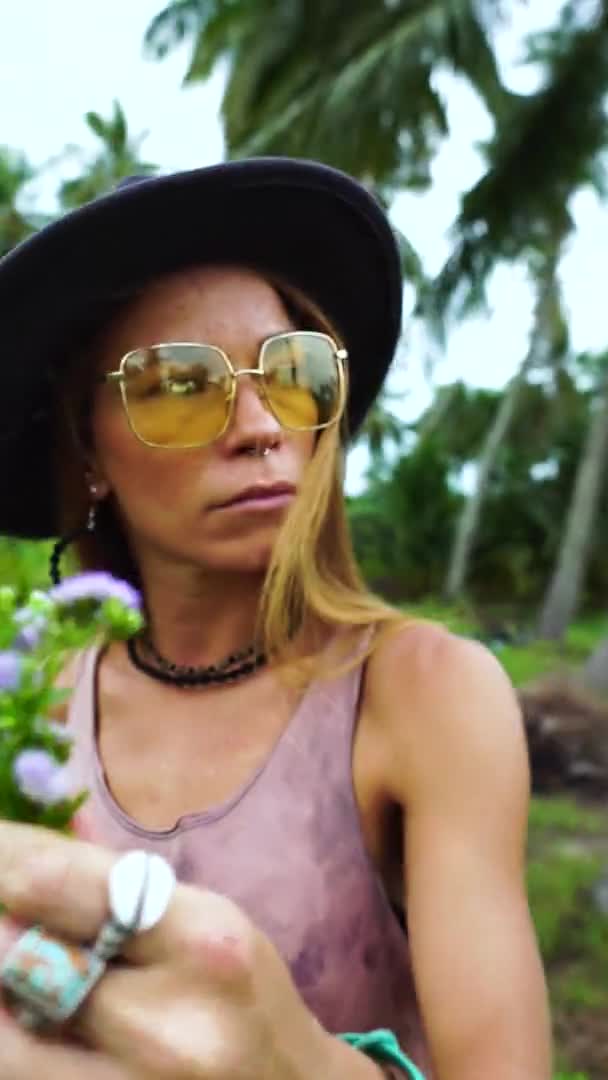 Vertical Shot Asian Woman Black Hat Holding Bunch Wildflowers While — Stok video