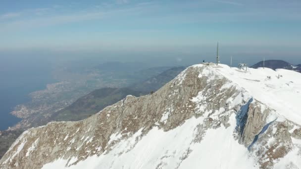 Aerial Tall Radio Tower Top Snow Covered Mountain — Stockvideo