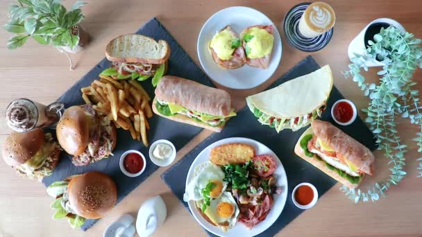 Male Hand Rotating Eggs Benedict Cafe Brunch Flat Lay Sandwiches — Vídeo de Stock