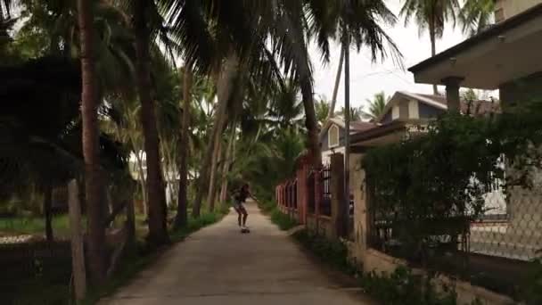 Tall Russian Model Riding Surfskate Road Rural Vietnam Gliding Dirt — Video Stock