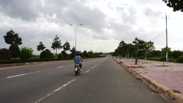 Travel Girl Braided Hair Drives Scooter Empty Road Vietnam — Video