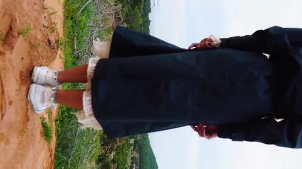 Ginger Haired Girl Standing Hilltop Enjoying Mountain View Windmill Farm — Vídeo de stock