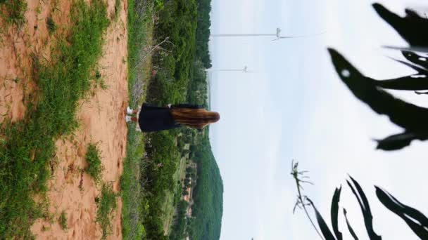 Long Haired Girl Enjoying Scenic Windmill Farm View Cloudy Weather — Vídeos de Stock