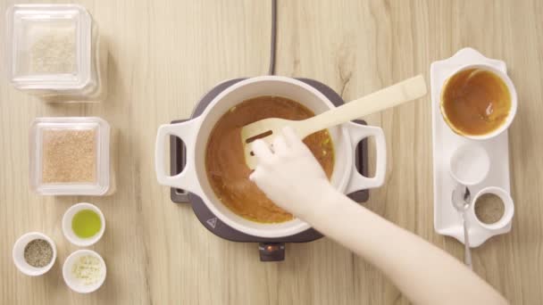 Chef Sprinkling Salt Spices Red Soup Stir Top View — Vídeo de Stock