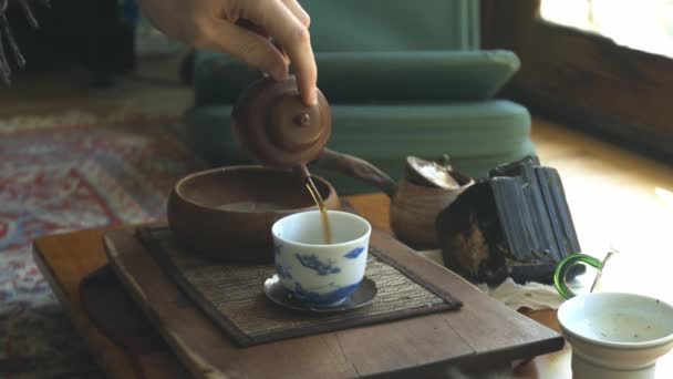 Tea Being Poured Authentic Clay Tea Pot White Blue Cup — Stok Video