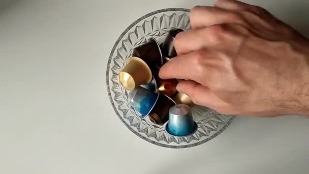 Clear Glass Full Coffee Machine Capsules Seen Male Hand Shuffles — 图库视频影像