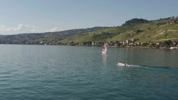 Flying Small Motorboat Driving Lake Geneva — Stockvideo