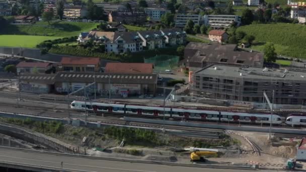 Aerial Train Leaving Station Small Swiss Town — Stockvideo