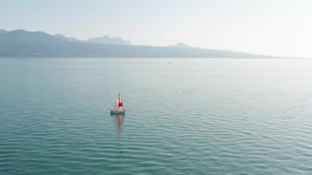 Aerial Small Sail Boat Vast Blue Lake — Stockvideo