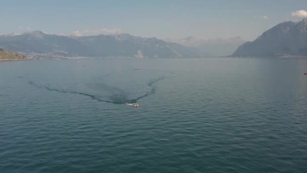 Beautiful Aerial Small Motorboat Driving Lake Geneva — Stock videók