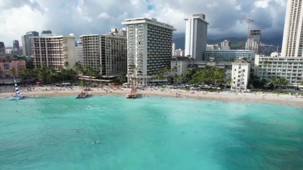 Drone Glides Tropical Beach Revealing Luxury Water Front Hotels Families — Vídeos de Stock