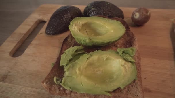 Avocado Toast Bread Top Wooden Board High Angle Close — Video Stock